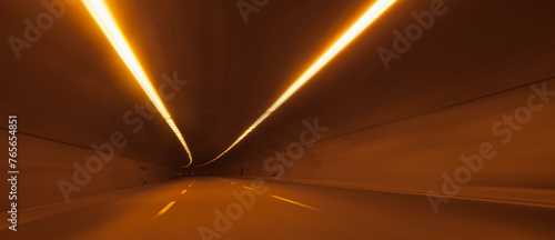 Abstract highway road tunnel with car light 