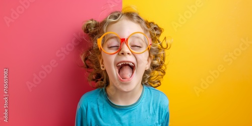 Happy child laughing with glasses and open mouth