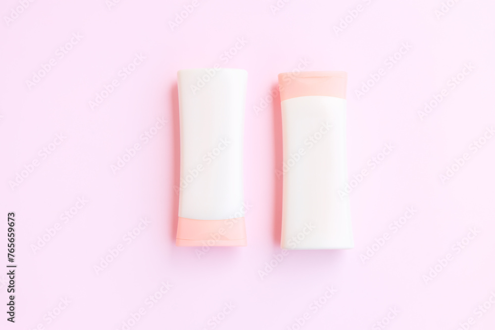 Cosmetic bottle containers isolated on pink background, Beauty products Cosmetic bottle containers isolated on pink background, Beauty products
