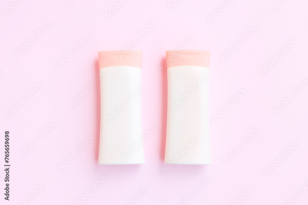 Cosmetic bottle containers isolated on pink background, Beauty products Cosmetic bottle containers isolated on pink background, Beauty products