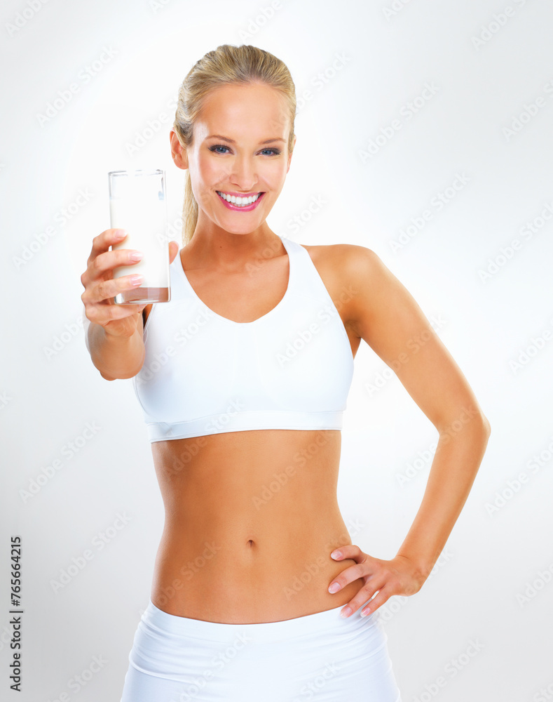 Portrait, happy woman and glass of milk for exercise in studio background with nutrition, vitamins and calcium. Organic, healthy and wellness for diet with dairy, protein and muscle to support bone Portrait, happy woman and glass of milk for exercise in studio background with nutrition, vitamins and calcium. Organic, healthy and wellness for diet with dairy, protein and muscle to support bone