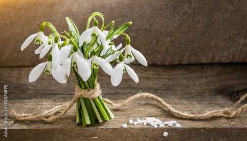 snowdrops on wooden background  bouquet of snowdrops on wooden background