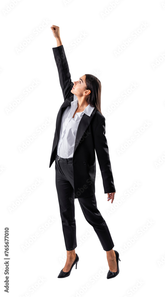 A businesswoman in a black suit is posing with her fist raised high against a white background, conveying the concept of power and determination A businesswoman in a black suit is posing with her fist raised high against a white background, conveying the concept of power and determination