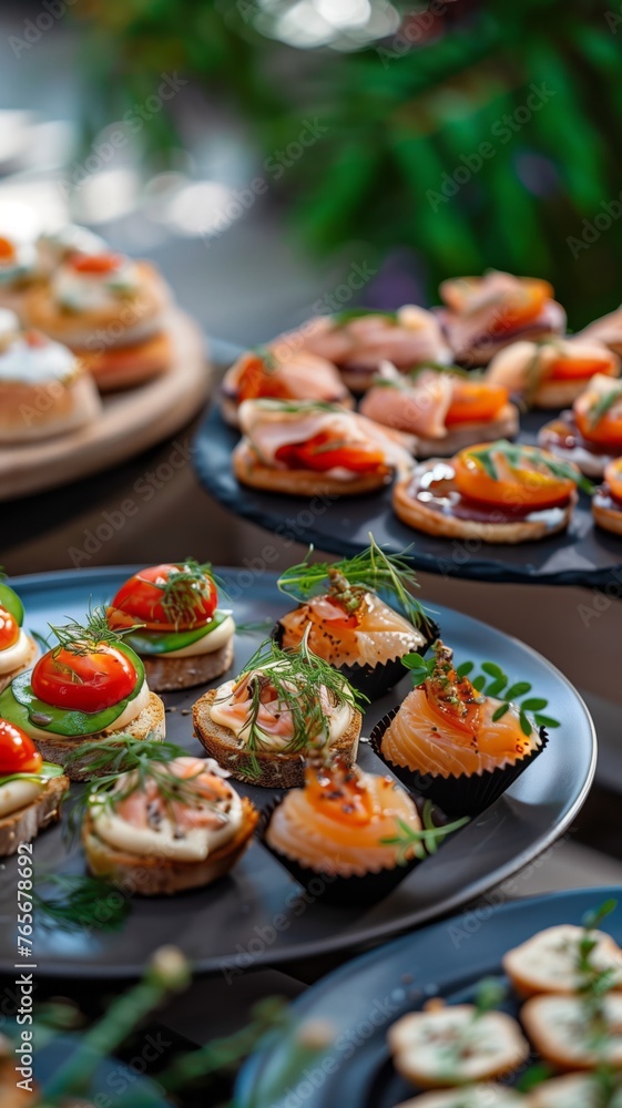 Catering table with various creative and delicious food: canape, snacks and appetizers. Catering plate. Assortment of sandwiches and tartlets on the buffet table. Meat, fish, vegetable canapes. Catering table with various creative and delicious food: canape, snacks and appetizers. Catering plate. Assortment of sandwiches and tartlets on the buffet table. Meat, fish, vegetable canapes.