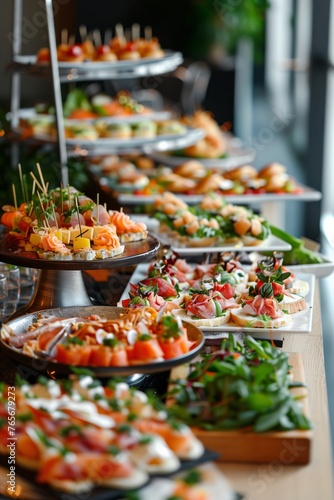 Catering table with various creative and delicious food: canape, snacks and appetizers. Catering plate. Assortment of sandwiches and tartlets on the buffet table. Meat, fish, vegetable canapes.