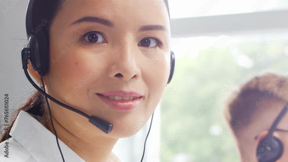 Diverse team of young professionals is working in the phone support office. Working day of sales managers in the call center. Business, telephone consulting and problem solving.