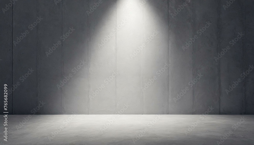 Abstract empty, modern concrete room with spot light shining down on the back wall Abstract empty, modern concrete room with spot light shining down on the back wall