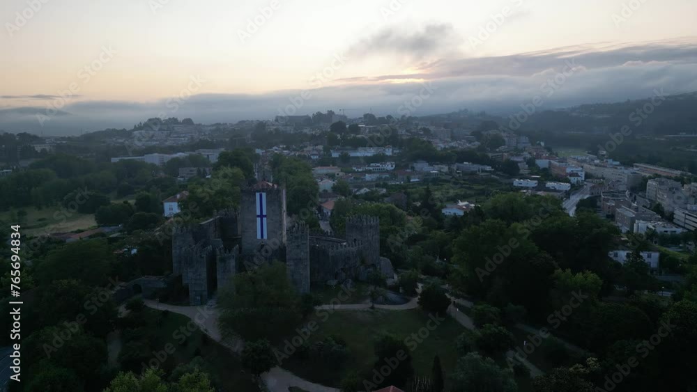 Aerial shot of a castle showing the area around it full of trees. Aerial shot of a castle showing the area around it full of trees.