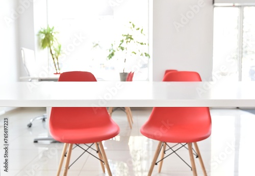 white office with red chairs