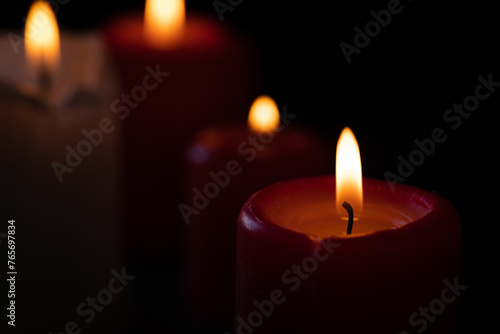 Burning candles on a black background