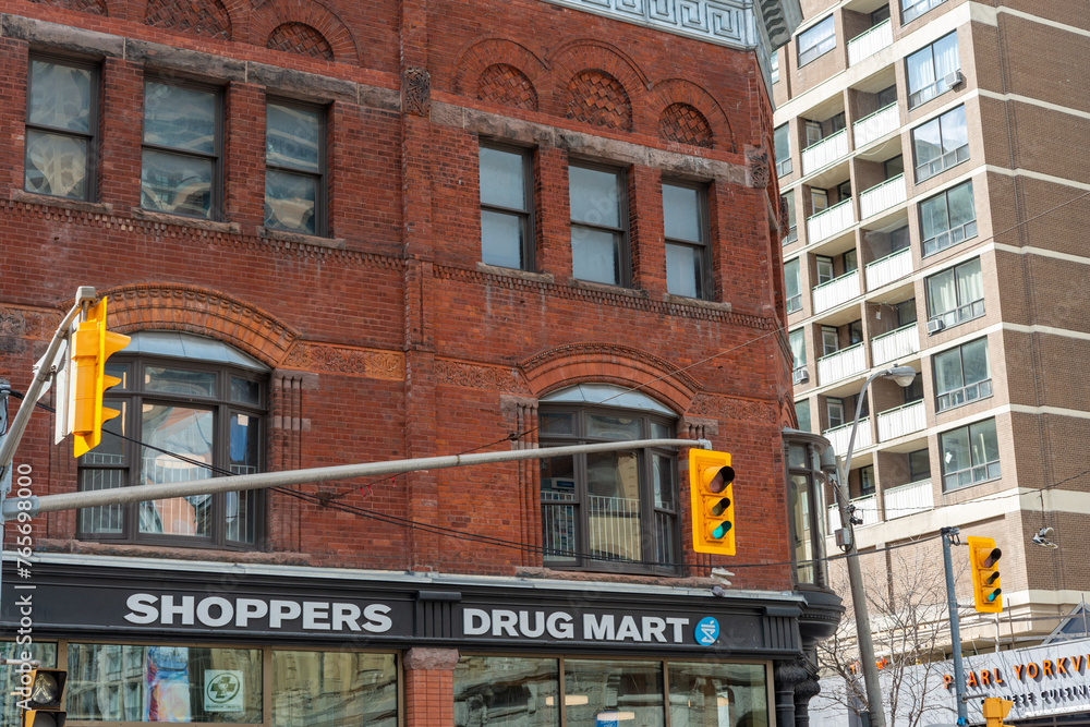 exterior building facade and sign of Shoppers Drug Mart, a ubiquitous