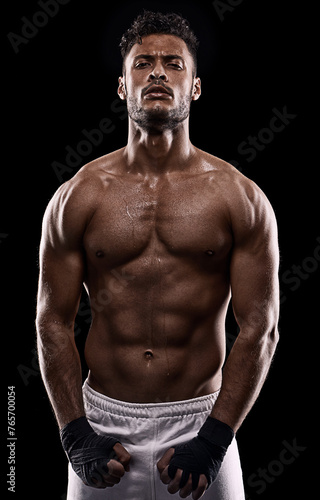 Man, muscle and portrait for active, muscular and health for wellness and fit for ripped in studio. Indian person and serious for strong, fitness and power for recreation and workout for fight