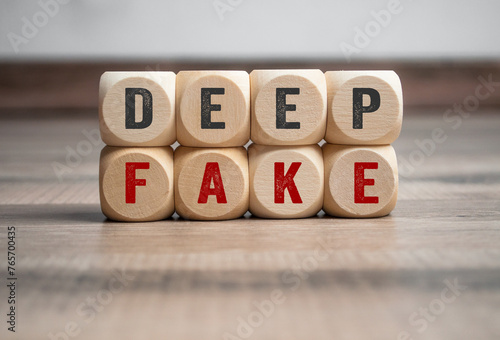Cubes, dice or blocks with deep fake, deepfake on wooden background photo