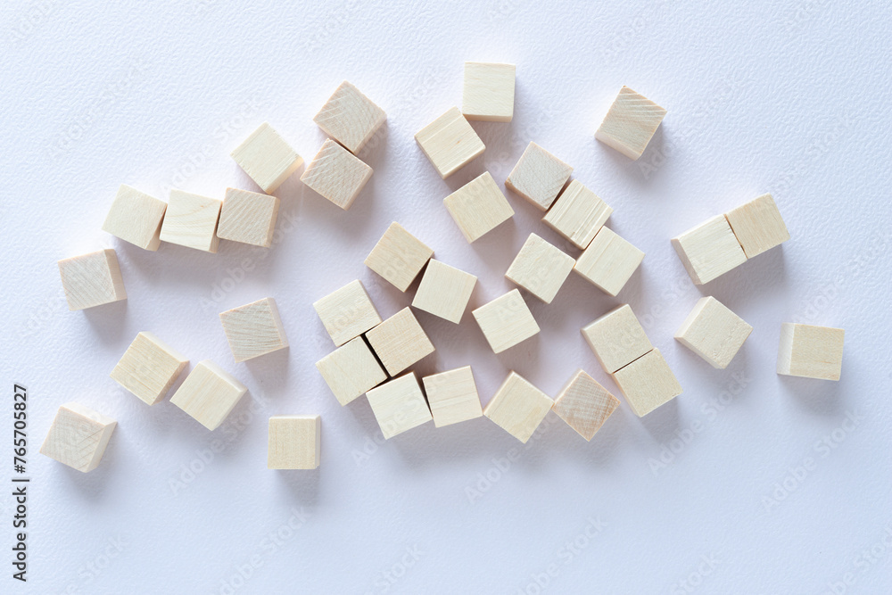 scattered wood cubes on paper scattered wood cubes on paper