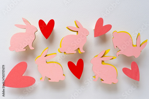 wooden easter rabbit shapes (in pink and yellow) and painted wooden hearts