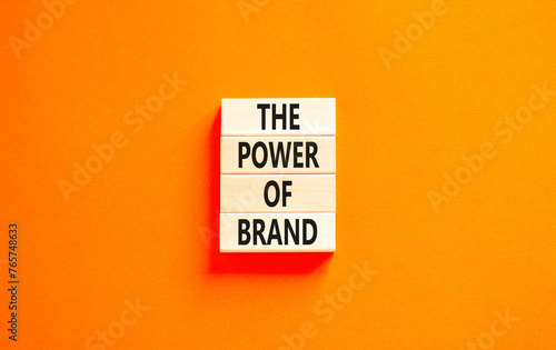 The power of brand symbol. Concept words The power of brand on beautiful wooden block. Beautiful orange table orange background. Business the power of brand concept. Copy space.
