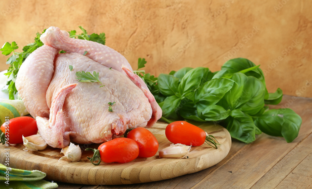 raw fresh organic chicken on wooden board