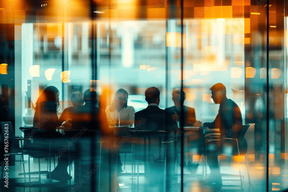 Group of business people having meeting at outdoor table in front of modern office building with blurred glass walls Group of business people having meeting at outdoor table in front of modern office building with blurred glass walls