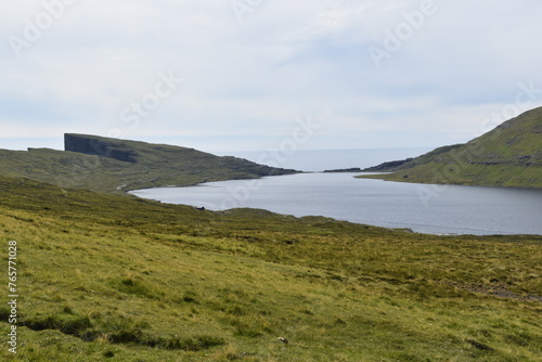 The dramatic coastline and green mountains of the Faroe Islands