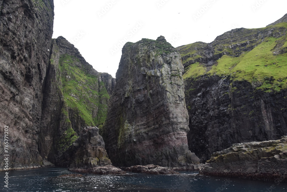 The dramatic coastline and green mountains of the Faroe Islands