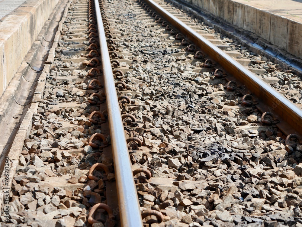 Naklejka premium train track, railway tracks in the countryside, A train traveling down train tracks, Railroad tracks