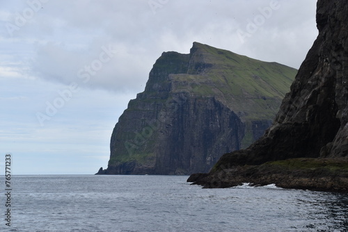 The dramatic coastline and green mountains of the Faroe Islands © ChrisOvergaard