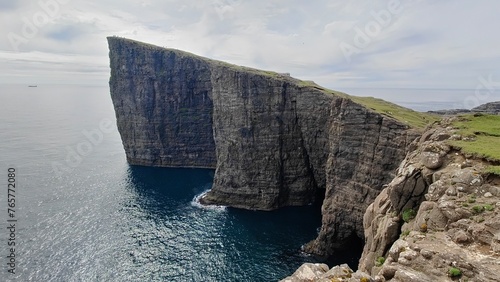 The dramatic coastline and green mountains of the Faroe Islands