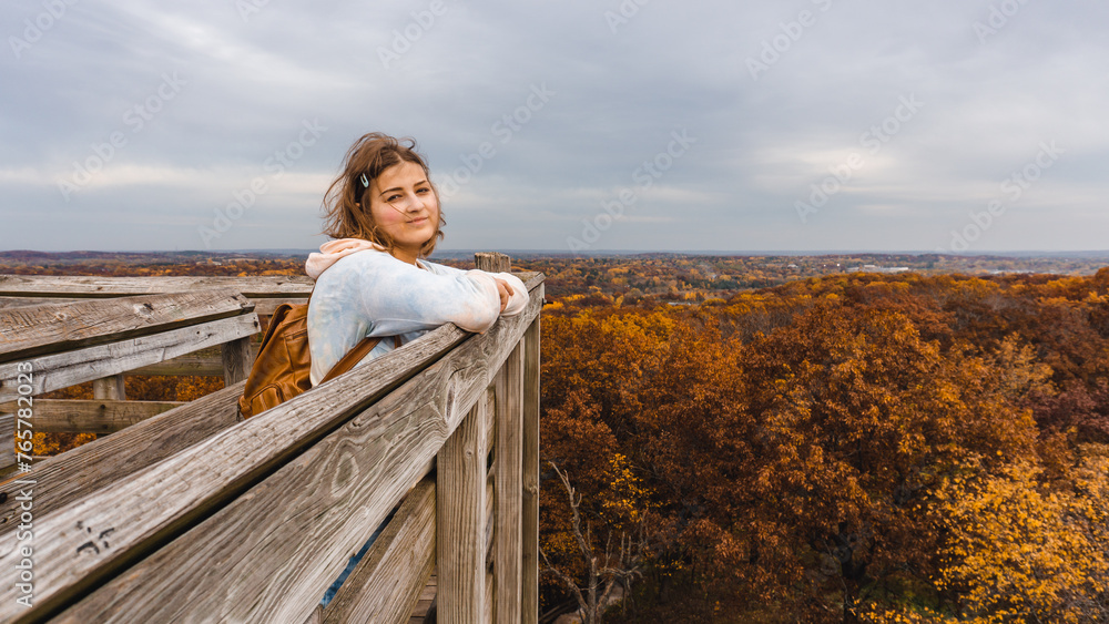 woman standing on edge of lookout tower