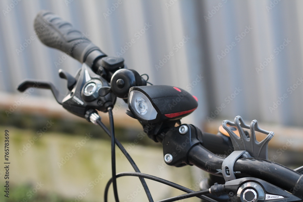 flashlight on the handlebars of a sports bike flashlight on the handlebars of a sports bike