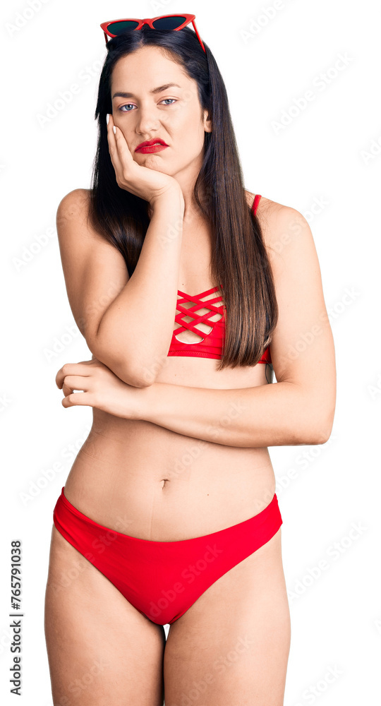 Fototapeta premium Young beautiful caucasian woman wearing bikini thinking looking tired and bored with depression problems with crossed arms.