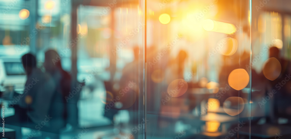 blurred business people through glass windows in a modern office setting blurred business people through glass windows in a modern office setting