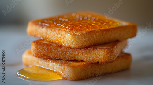Fresh honey with toast biscuit on a white background (ID: 765796004)