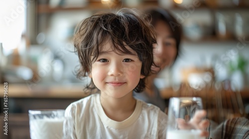 The children are joyfully drinking milk with their parents, enjoying quality time together.