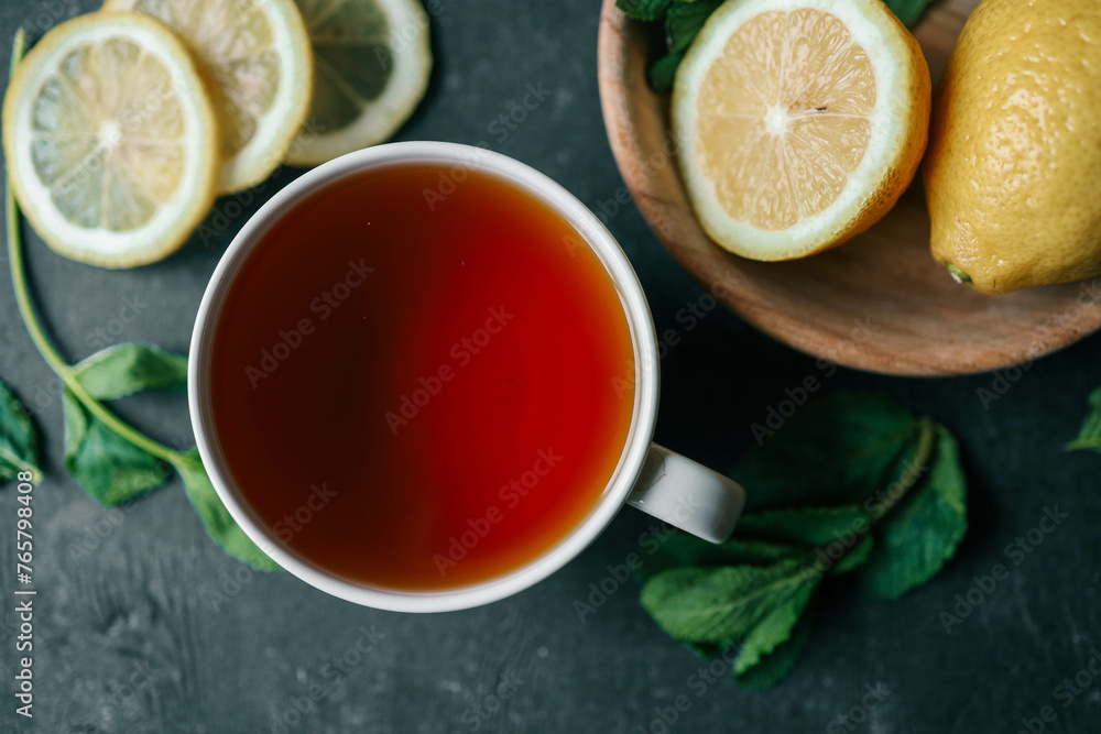 Glass cup with hot tea and lemon on table Glass cup with hot tea and lemon on table
