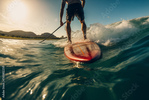 Paddleboarder Gliding Through Ocean Waves © TinyUU
