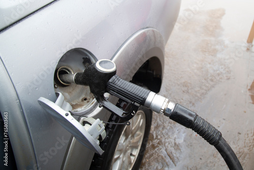 A gun for refueling cars with fuel.Rising fuel prices. The concept.