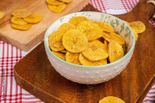 Green banana chips in bolw overhead view 