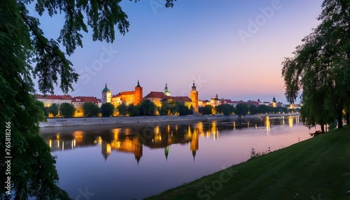 night view on the ancient castle over the river photo