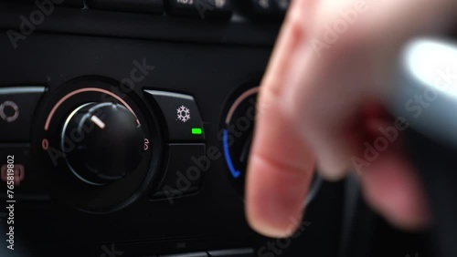 Close-up 4k - Turning on the air conditioner in the car