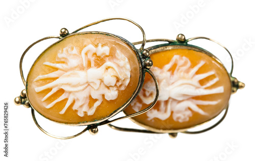 Bild auf Leinwand antique earrings with cameo carved on natural see shells close up isolated on wh