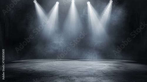 A captivating monochrome image of spotlights streaming through mist onto an unoccupied stage