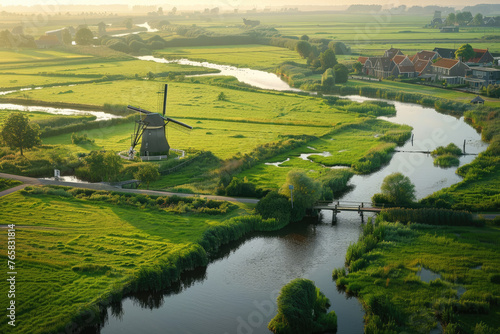 An aerial view of the picturesque Dutch countryside, showcasing windmills and canals photo
