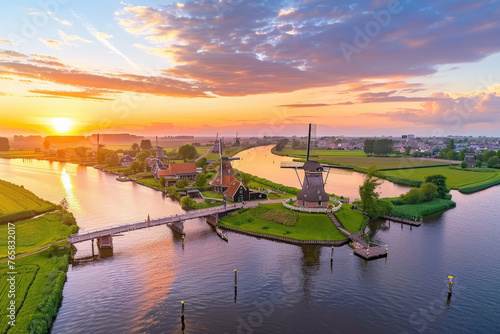 An aerial view of the picturesque Dutch countryside, showcasing windmills and canals photo