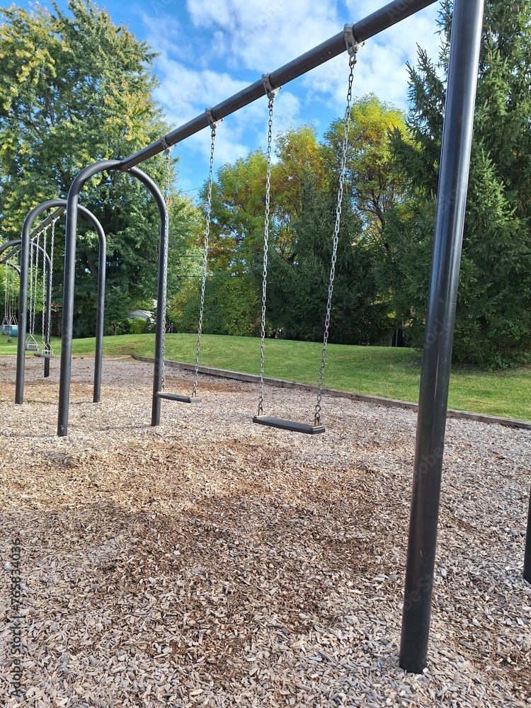 Stilled swings on a public playground for children