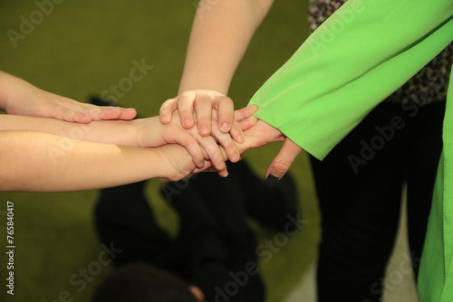 The child covered his eyes with his hands