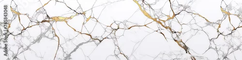 Panel kuchenny z motywem A white marble wall with gold accents. The wall is textured and has a natural look. The gold accents add a touch of luxury and elegance to the space
