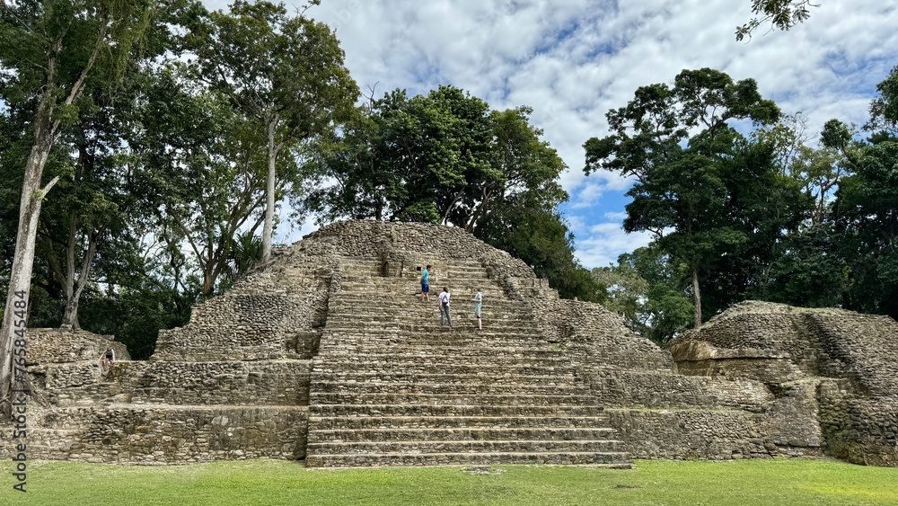 A temple ruins with tourists in San Ignacio Cahak Pech Archaeological Site in Belize A temple ruins with tourists in San Ignacio Cahak Pech Archaeological Site in Belize