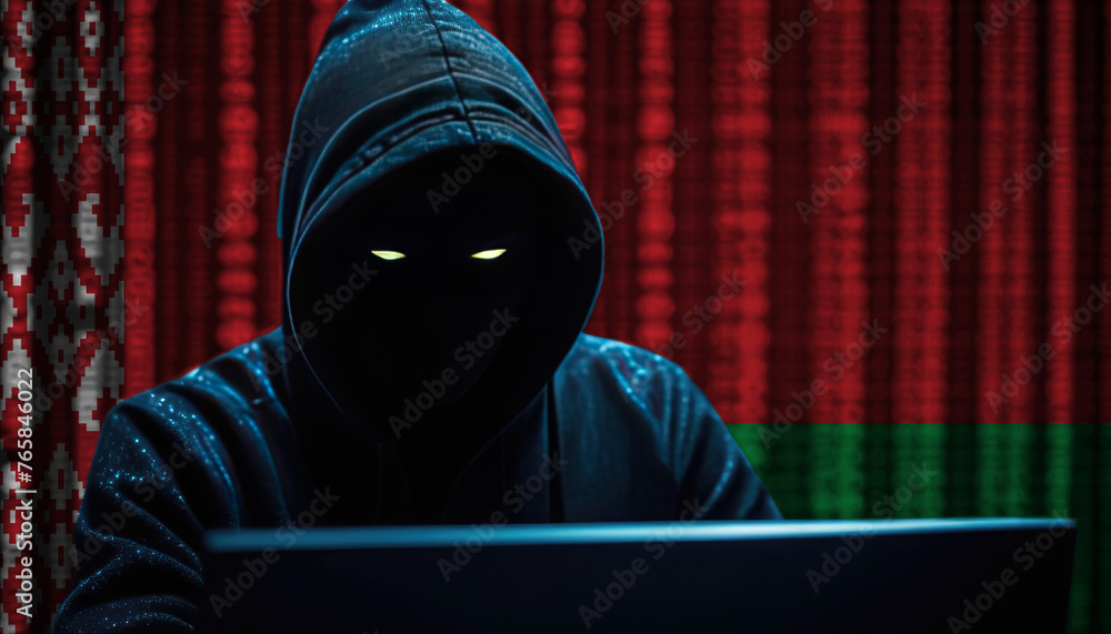 Hacker in a dark hoodie sitting in front of a monitors with Belarus flag and background cyber security concept Hacker in a dark hoodie sitting in front of a monitors with Belarus flag and background cyber security concept
