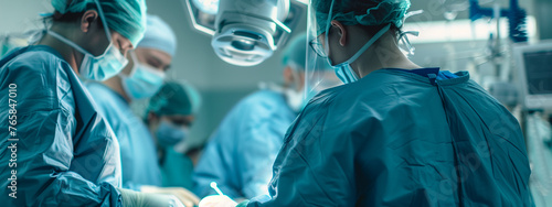 group of medical professionals in action in an operating room