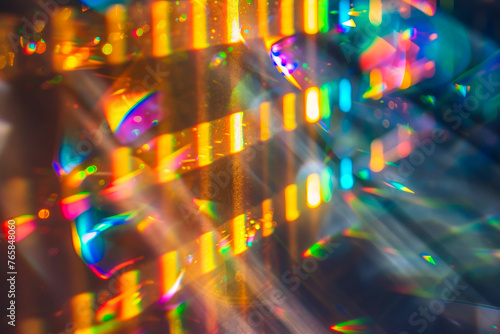 Soft-focus background with light rays and rainbow prism effects.